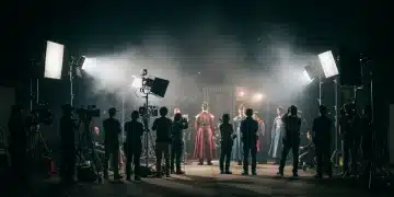 Behind-the-scenes K-drama production with crew and actors on a brightly lit set